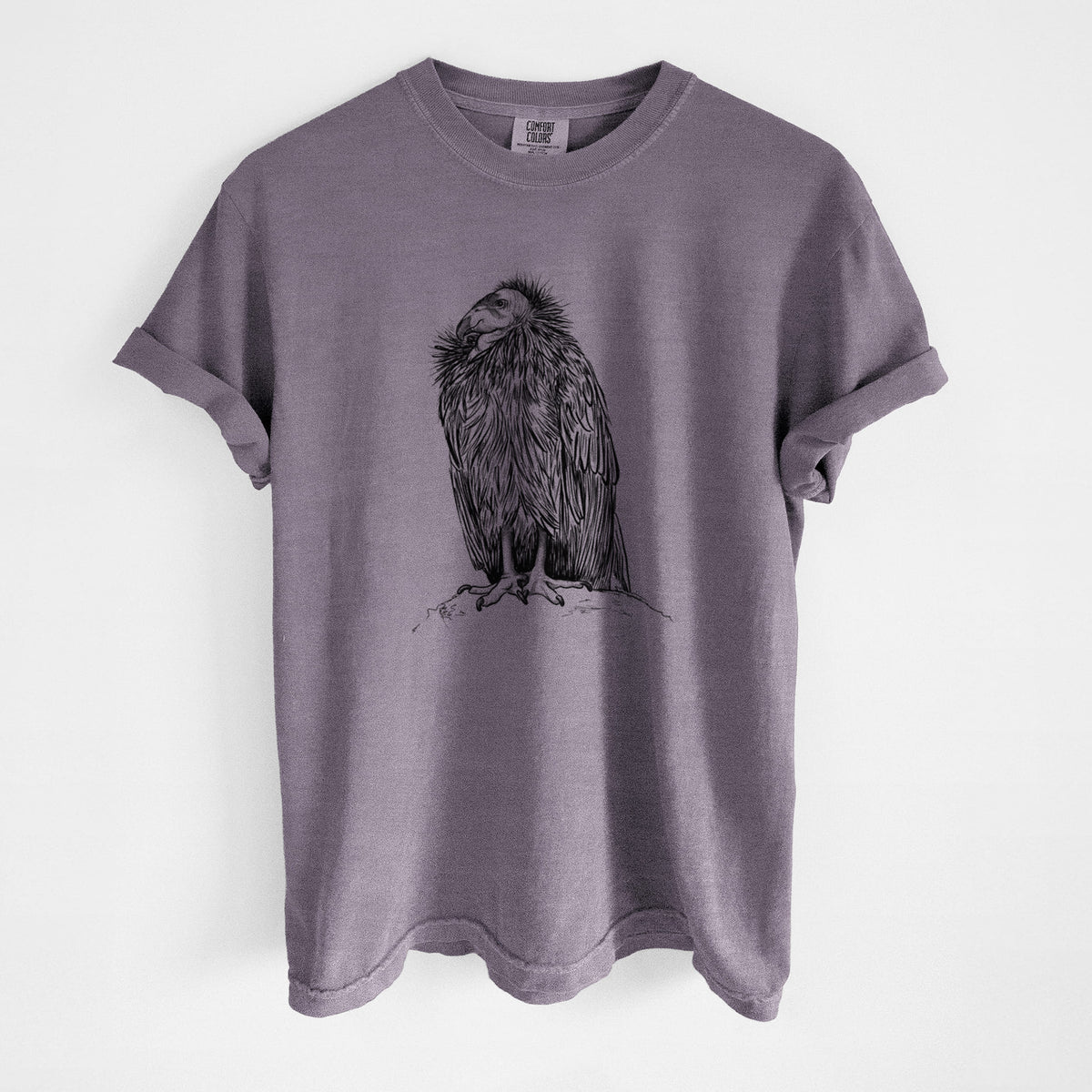 Wine red Comfort Colors t-shirt laid flat, printed with a detailed black ink illustration of a California condor perched with folded wings.