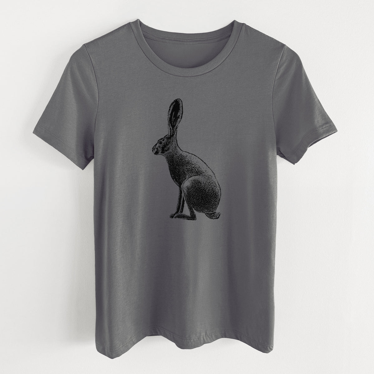 Asphalt women's relaxed fit cotton t-shirt laid flat, printed with a detailed black ink illustration of a black-tailed jackrabbit sitting in profile with tall ears.