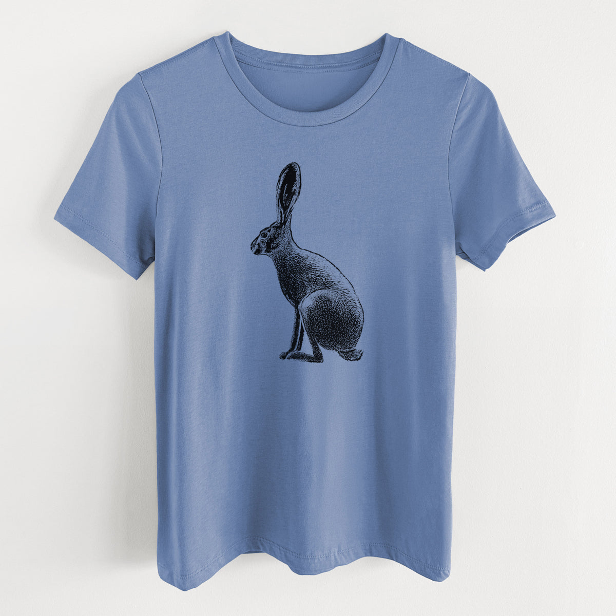Blue bell women's relaxed fit cotton t-shirt laid flat, printed with a detailed black ink illustration of a black-tailed jackrabbit sitting in profile with tall ears.