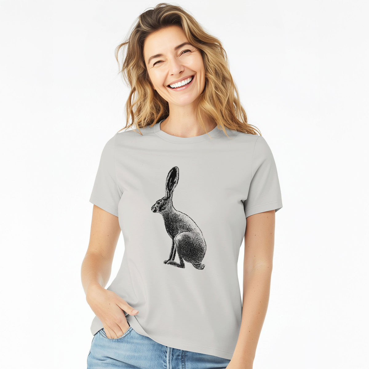 Woman wearing a lunar grey women's relaxed fit cotton t-shirt printed with a detailed black ink illustration of a black-tailed jackrabbit sitting in profile with tall ears.