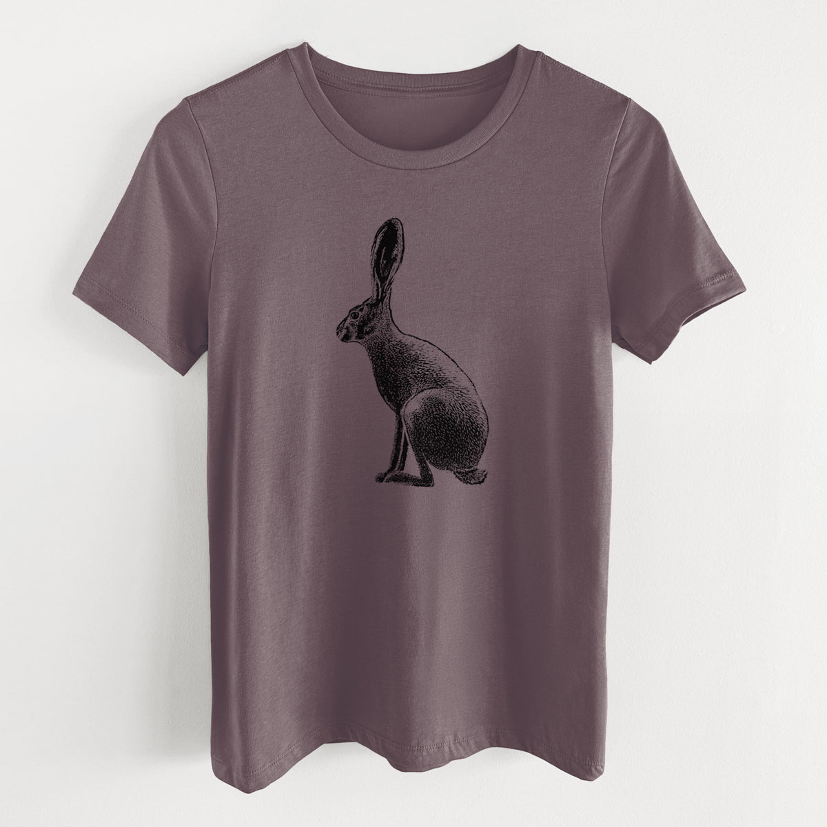 Purple storm women's relaxed fit cotton t-shirt laid flat, printed with a detailed black ink illustration of a black-tailed jackrabbit sitting in profile with tall ears.