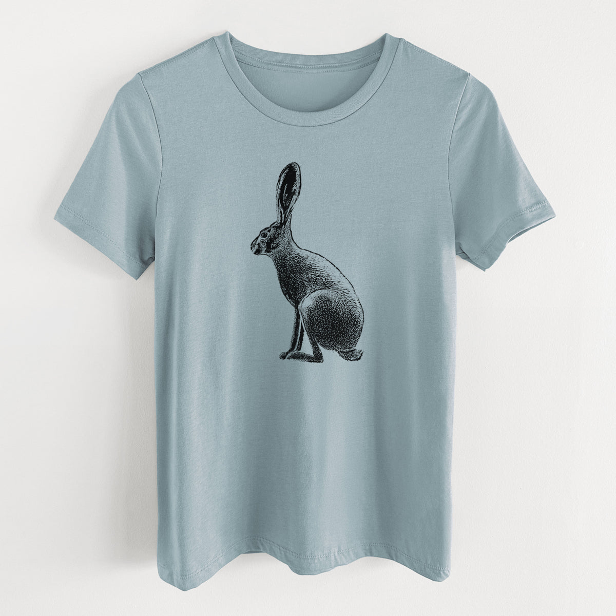 Vintage denim women's relaxed fit cotton t-shirt laid flat, printed with a detailed black ink illustration of a black-tailed jackrabbit sitting in profile with tall ears.