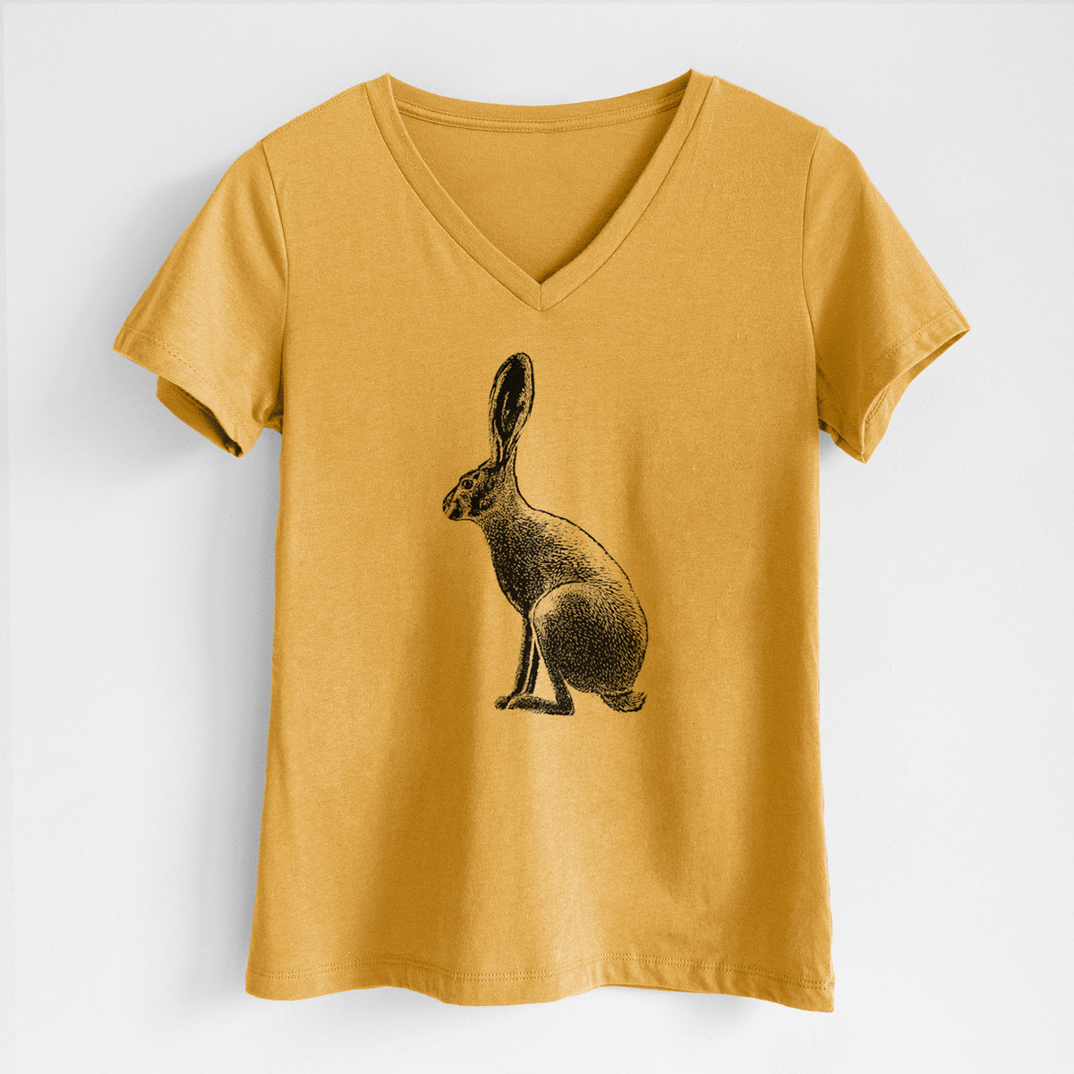 Honeycomb yellow women's relaxed fit cotton V-neck t-shirt laid flat, printed with a detailed black ink illustration of a black-tailed jackrabbit sitting in profile with tall ears.