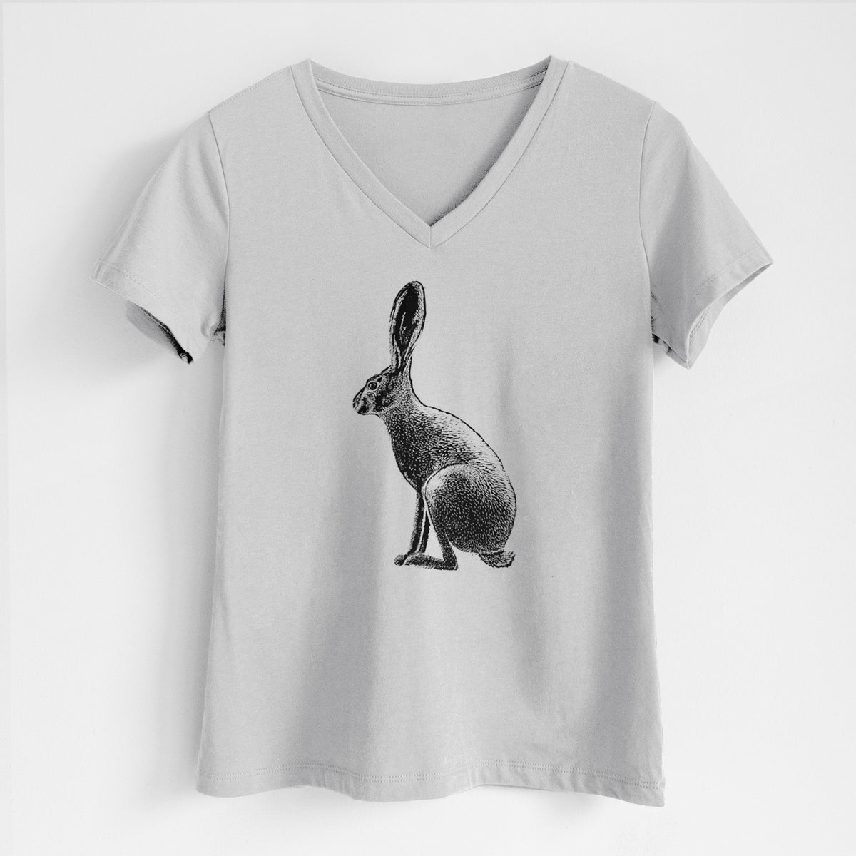 Lunar grey women's relaxed fit cotton V-neck t-shirt laid flat, printed with a detailed black ink illustration of a black-tailed jackrabbit sitting in profile with tall ears.
