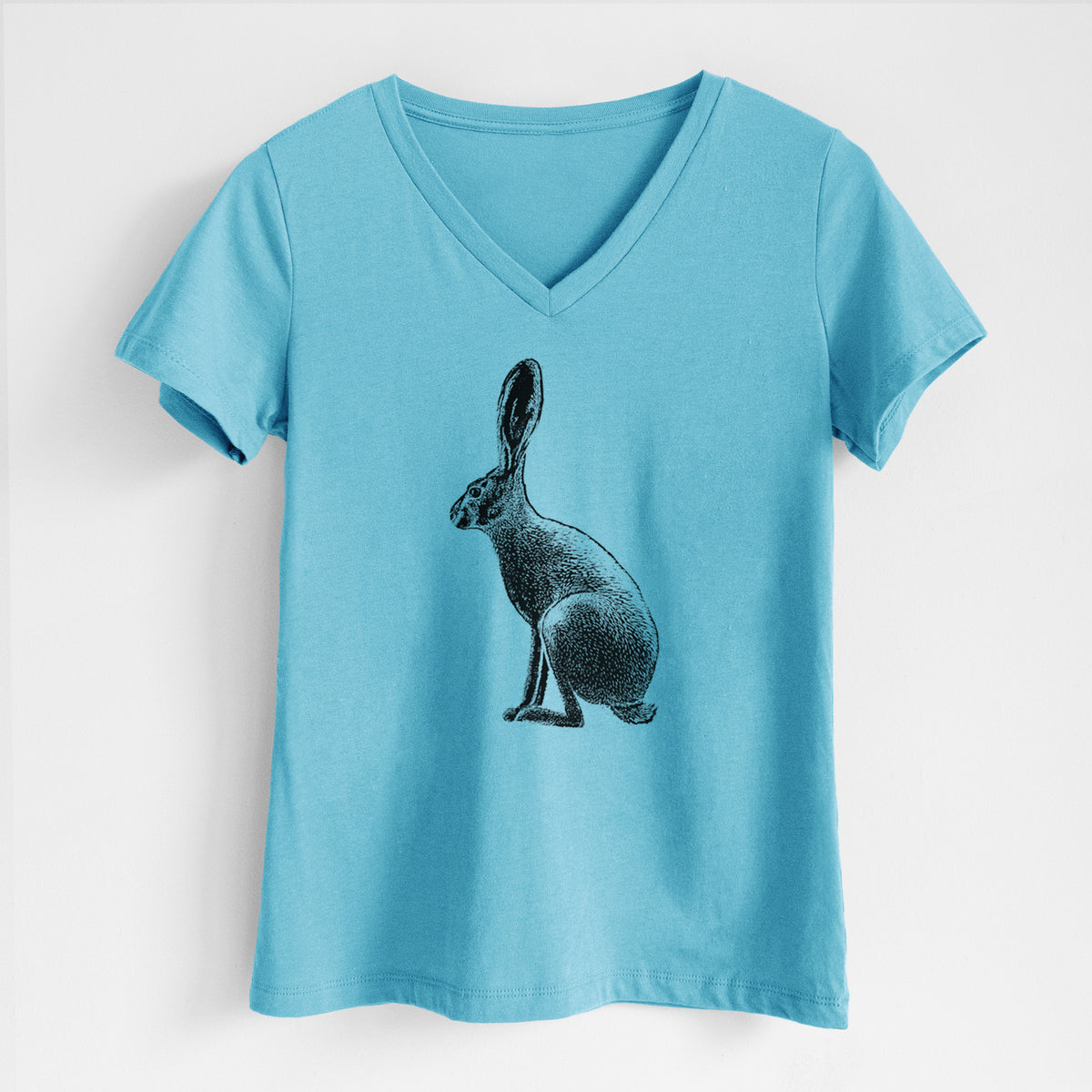 Turquoise women's relaxed fit cotton V-neck t-shirt laid flat, printed with a detailed black ink illustration of a black-tailed jackrabbit sitting in profile with tall ears.