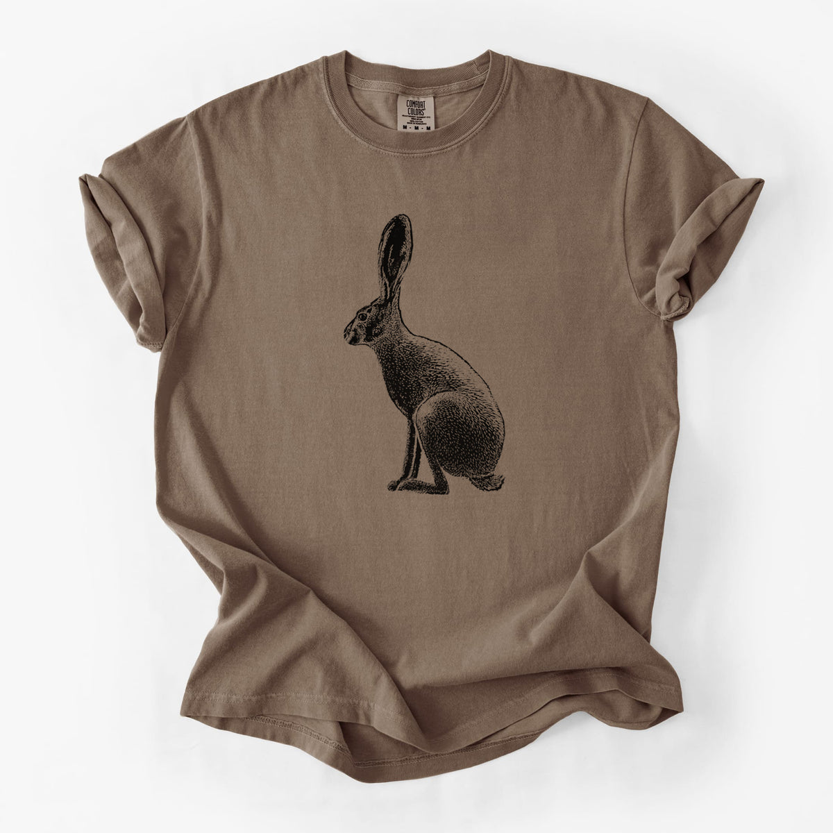 Espresso brown Comfort Colors t-shirt laid flat, printed with a detailed black ink illustration of a black-tailed jackrabbit sitting in profile with tall ears.