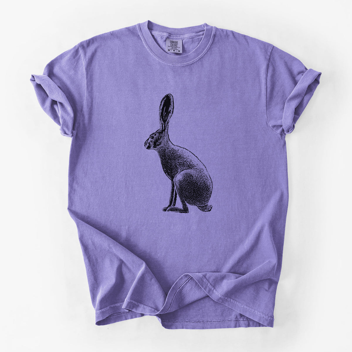 Violet purple Comfort Colors t-shirt laid flat, printed with a detailed black ink illustration of a black-tailed jackrabbit sitting in profile with tall ears.
