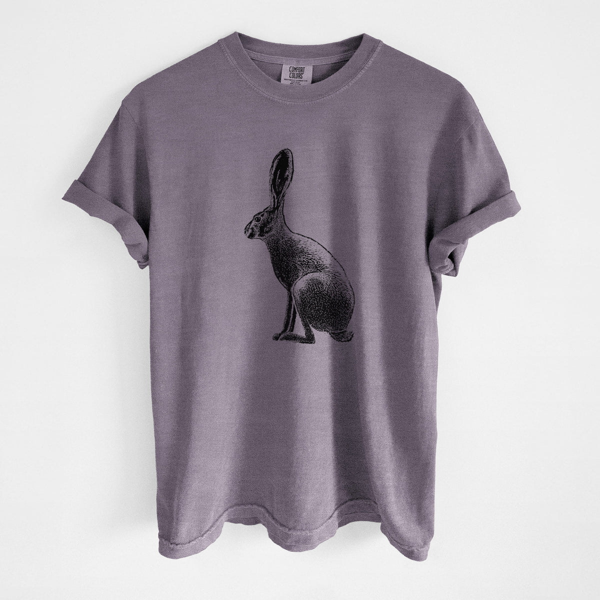 Wine red Comfort Colors t-shirt laid flat, printed with a detailed black ink illustration of a black-tailed jackrabbit sitting in profile with tall ears.