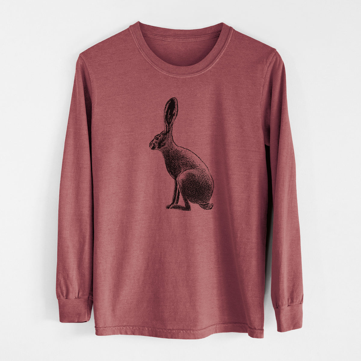 Brick red Comfort Colors long sleeve shirt laid flat, printed with a detailed black ink illustration of a black-tailed jackrabbit sitting in profile with tall ears.