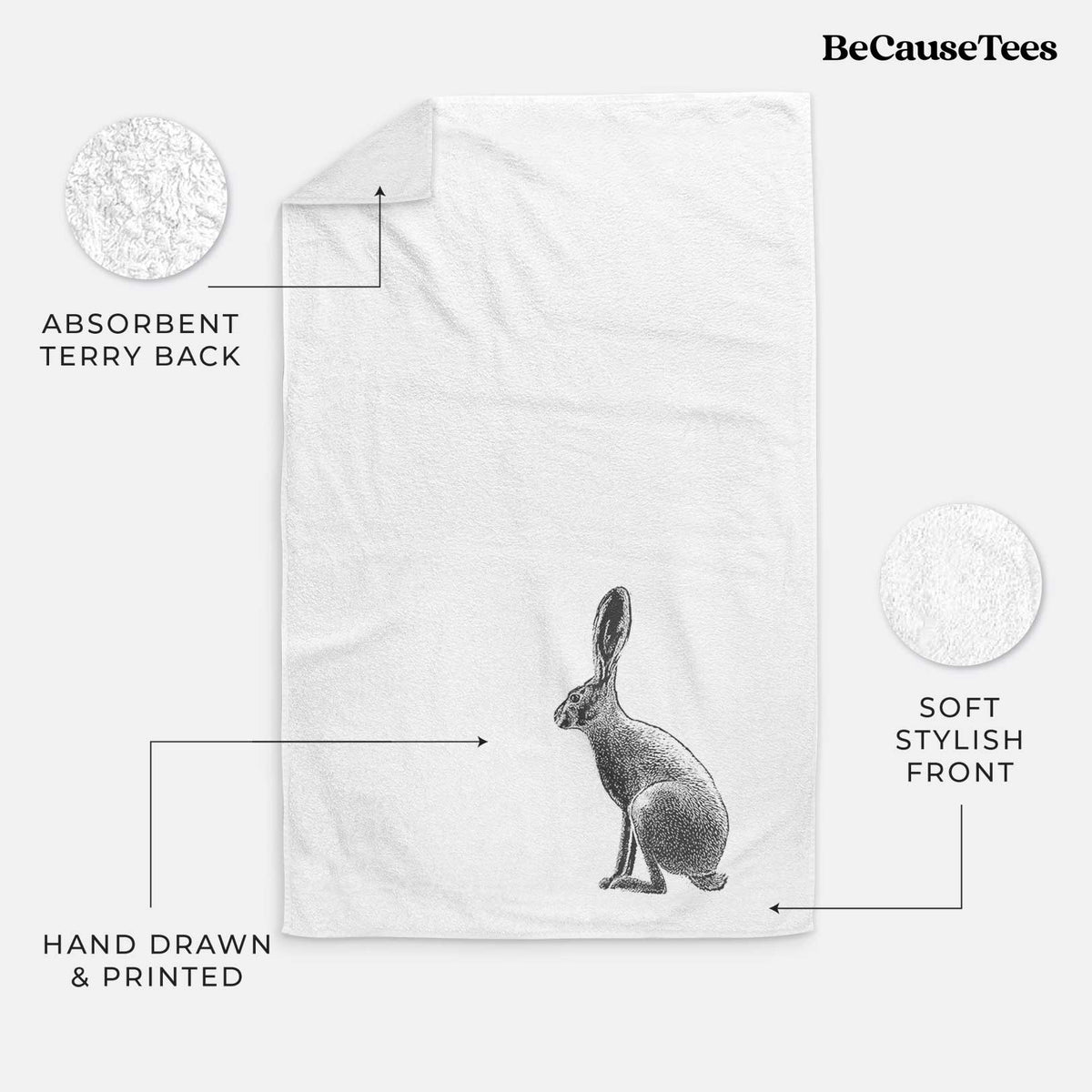 White hand towel printed with a detailed black ink illustration of a black-tailed jackrabbit sitting in profile with tall ears.