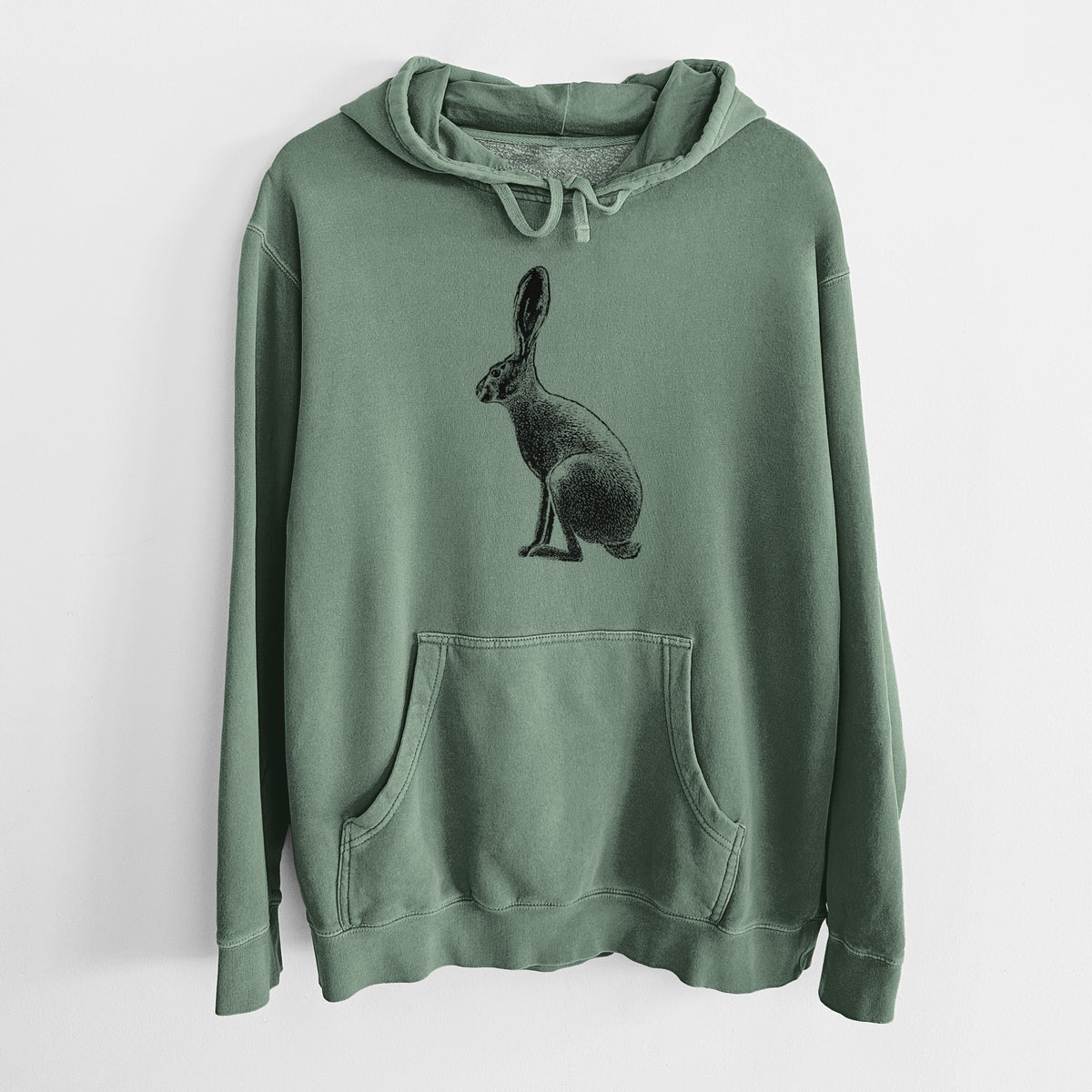 Alpine green pigment dyed hoodie laid flat, printed with a detailed black ink illustration of a black-tailed jackrabbit sitting in profile with tall ears.