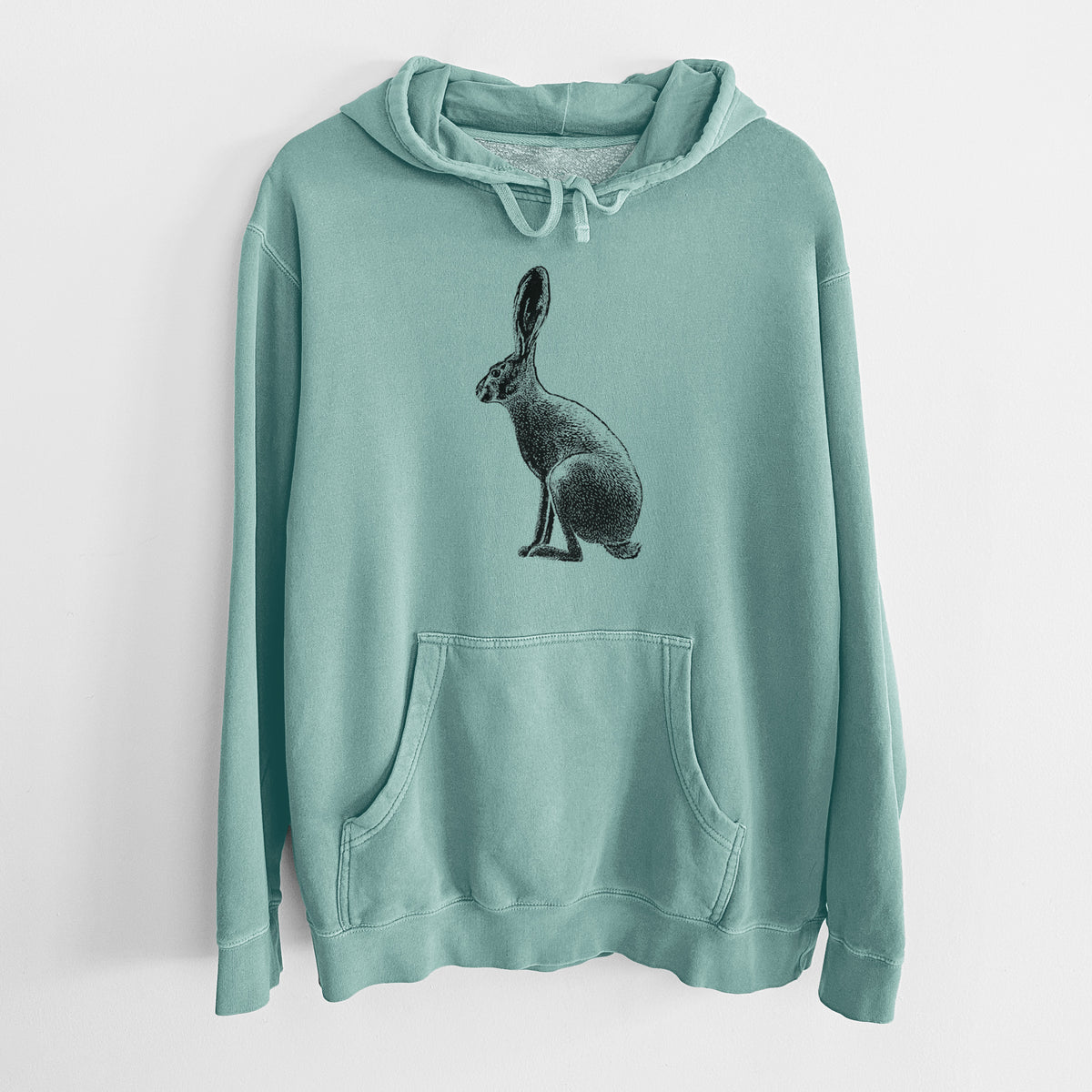 Mint green pigment dyed hoodie laid flat, printed with a detailed black ink illustration of a black-tailed jackrabbit sitting in profile with tall ears.