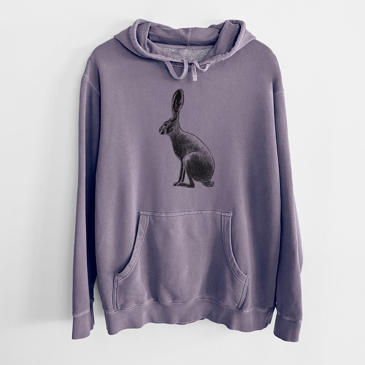 Plum purple pigment dyed hoodie laid flat, printed with a detailed black ink illustration of a black-tailed jackrabbit sitting in profile with tall ears.