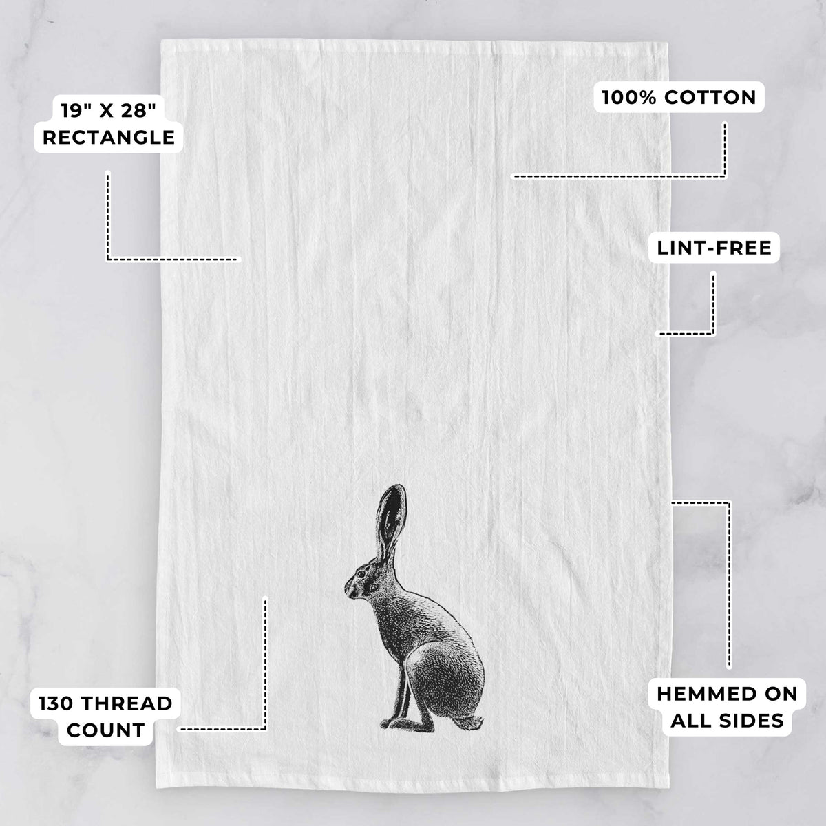White tea towel printed with a detailed black ink illustration of a black-tailed jackrabbit sitting in profile with tall ears, with feature labels: 19 by 28 inch rectangle, 100% cotton, lint-free, 130 thread count, hemmed on all sides.