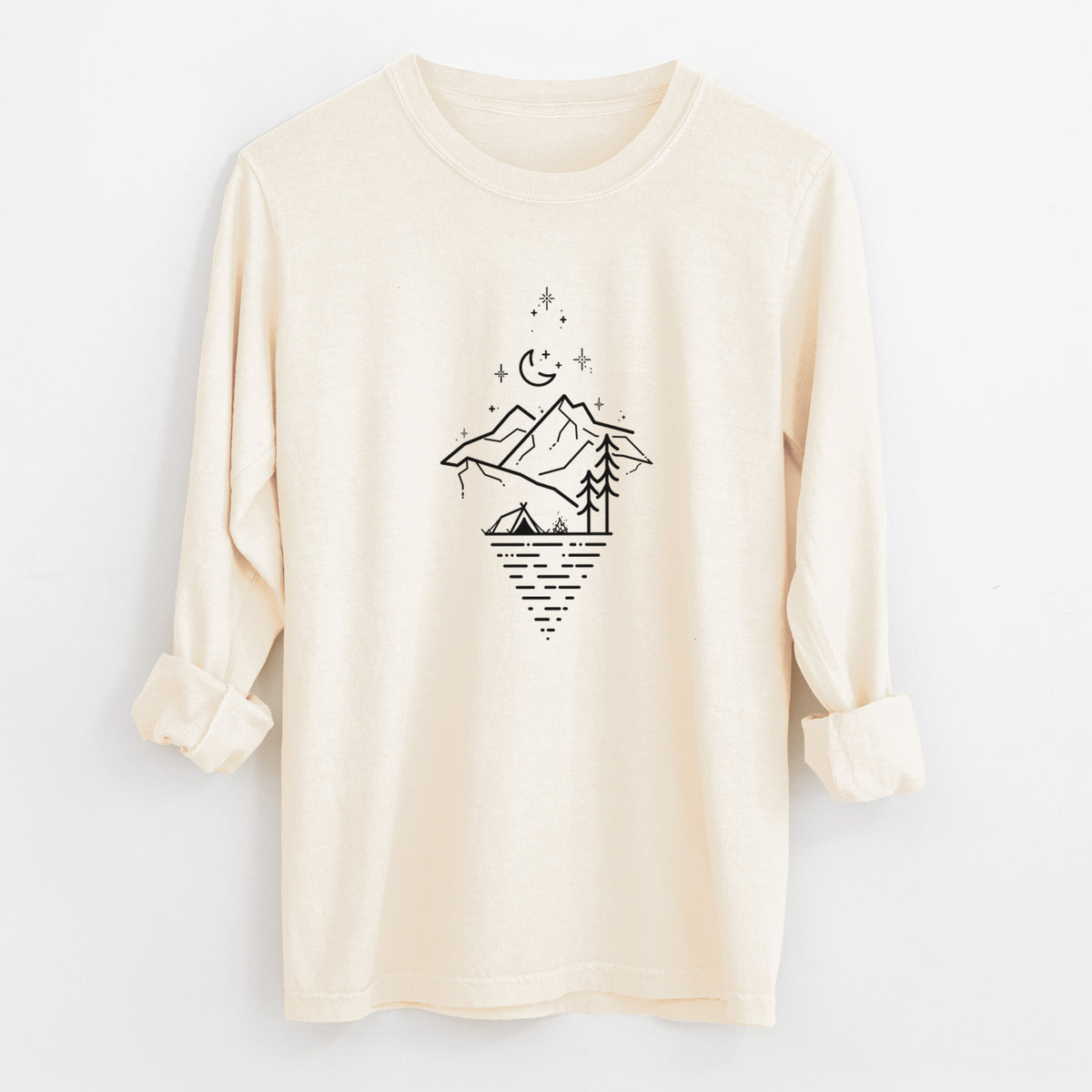 Ivory Comfort Colors long sleeve shirt laid flat with the cuffs rolled, printed with black line art of mountains, pine trees, a crescent moon and stars above a lake inside a diamond outline.