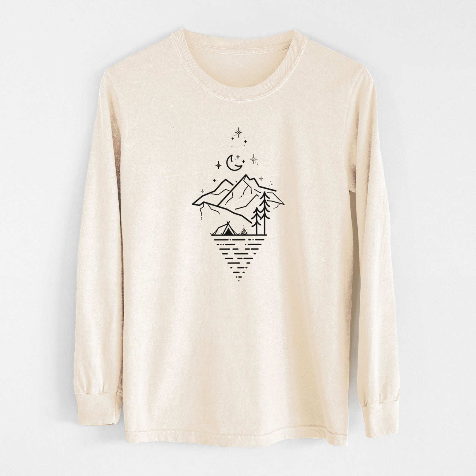 Ivory Comfort Colors long sleeve shirt laid flat, printed with black line art of mountains, pine trees, a crescent moon and stars above a lake inside a diamond outline.