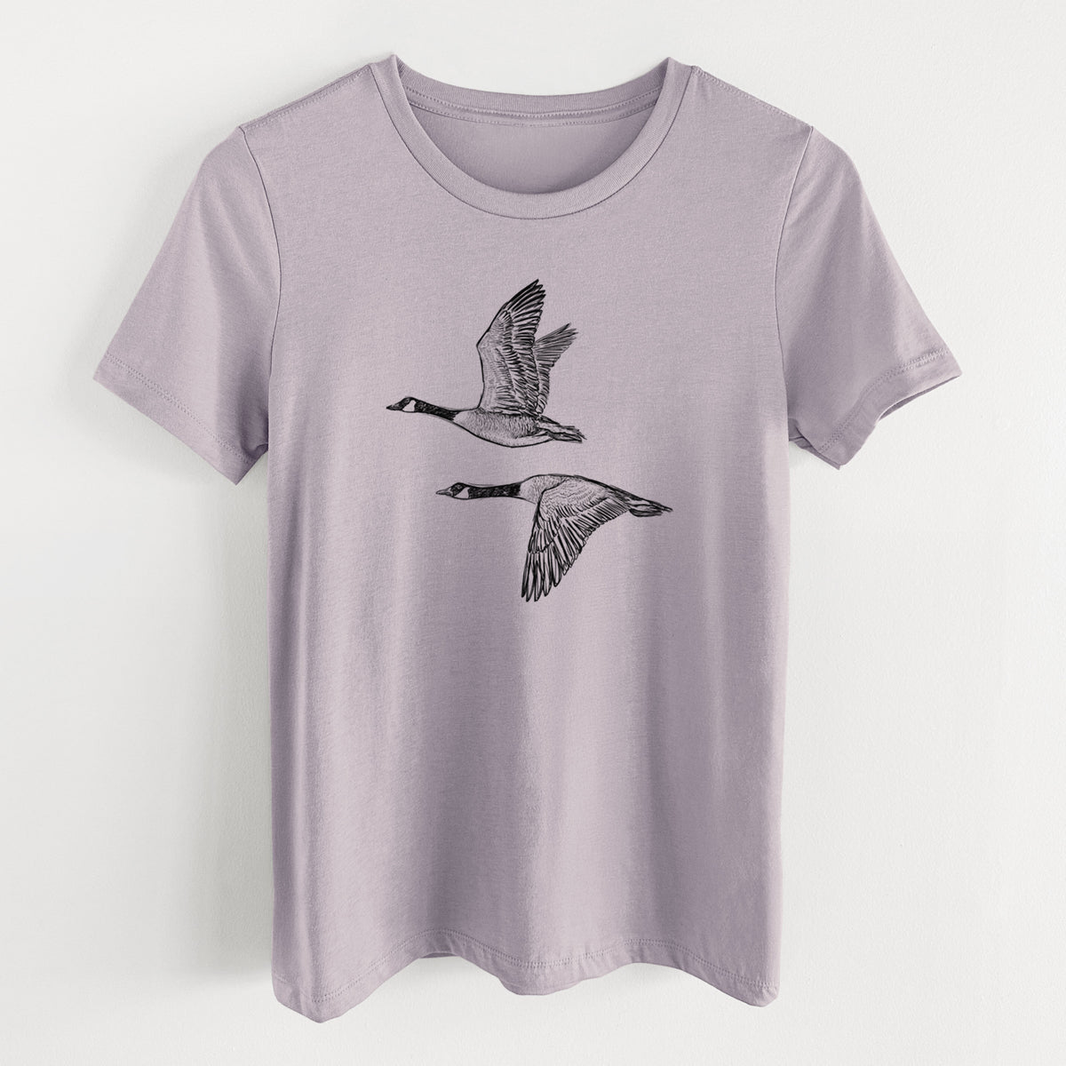 Canada Geese in Flight - Branta canadensis - Women's Lightweight Relaxed Fit 100% Cotton Crewneck in Light Violet, on a hanger