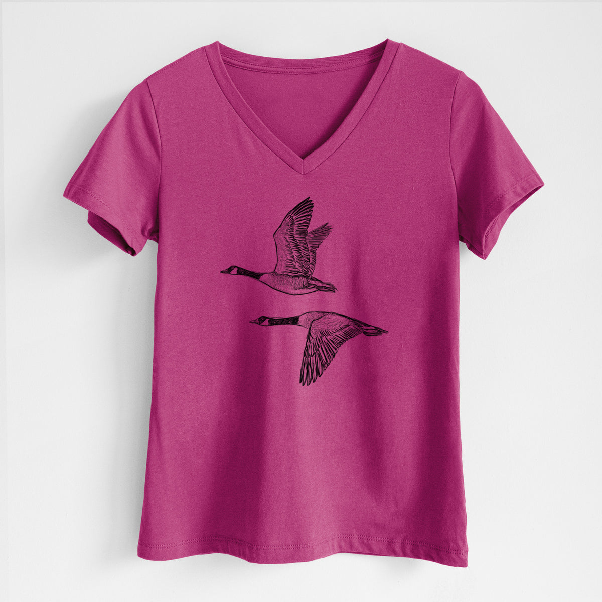 Canada Geese in Flight - Branta canadensis - Women's Lightweight Relaxed Fit 100% Cotton V-neck in Berry, on a hanger