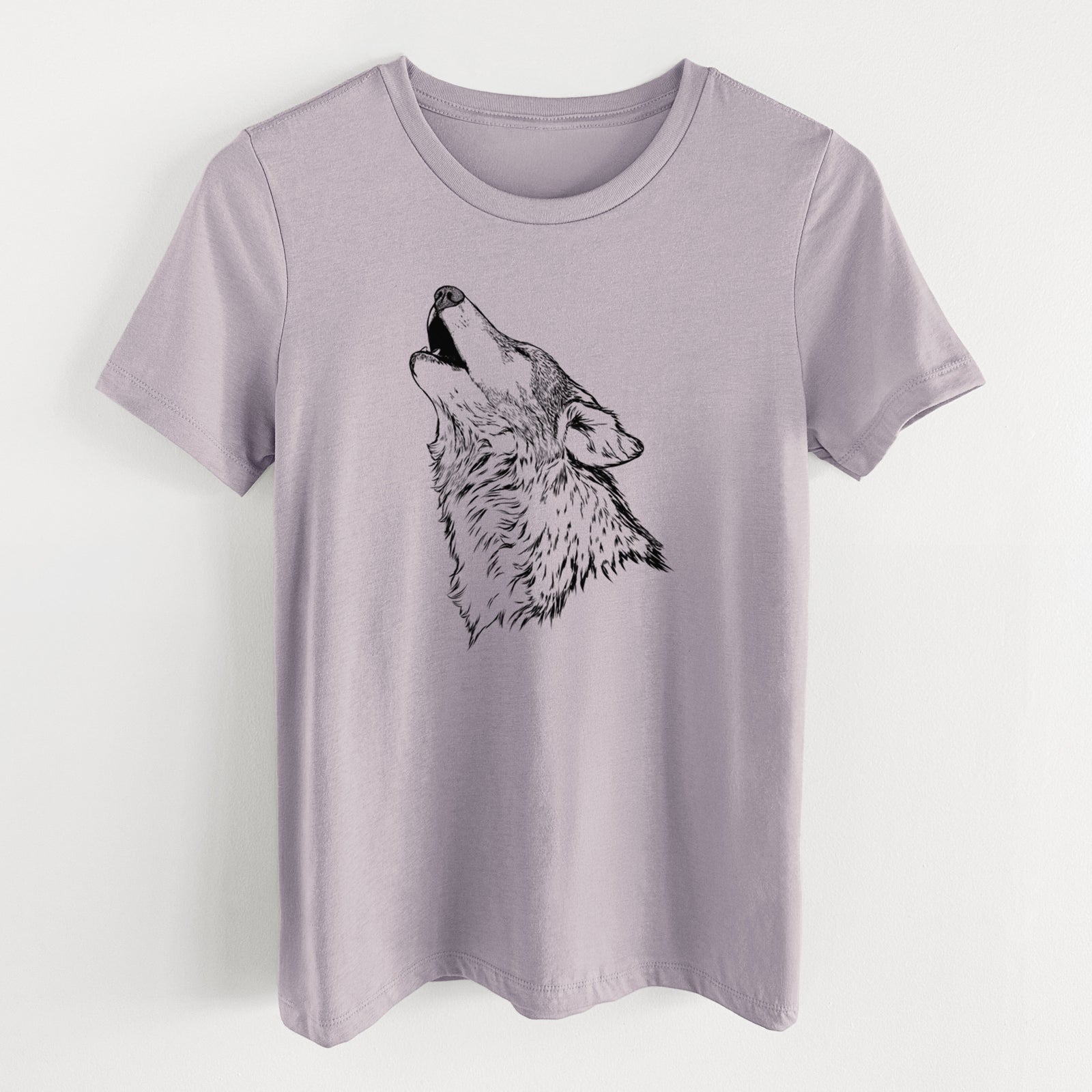 Light violet women's relaxed fit cotton t-shirt laid flat, printed with a detailed black ink illustration of a grey wolf's head and shoulders, howling upward.