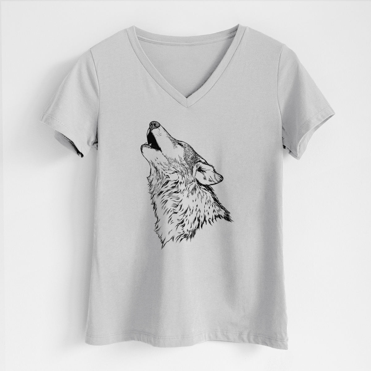 Lunar grey women's relaxed fit cotton V-neck t-shirt laid flat, printed with a detailed black ink illustration of a grey wolf's head and shoulders, howling upward.