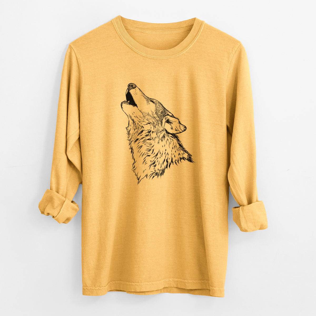 Golden wheat yellow Comfort Colors long sleeve shirt laid flat with the cuffs rolled, printed with a detailed black ink illustration of a grey wolf's head and shoulders, howling upward.
