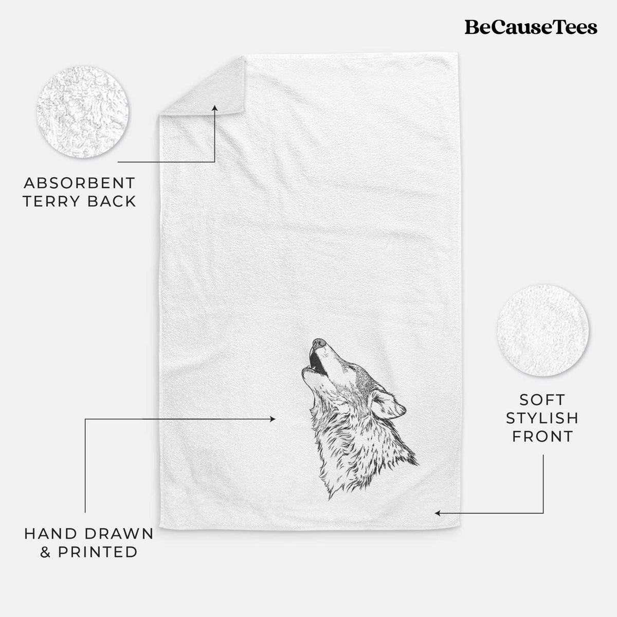 White hand towel printed with a detailed black ink illustration of a grey wolf's head and shoulders, howling upward.