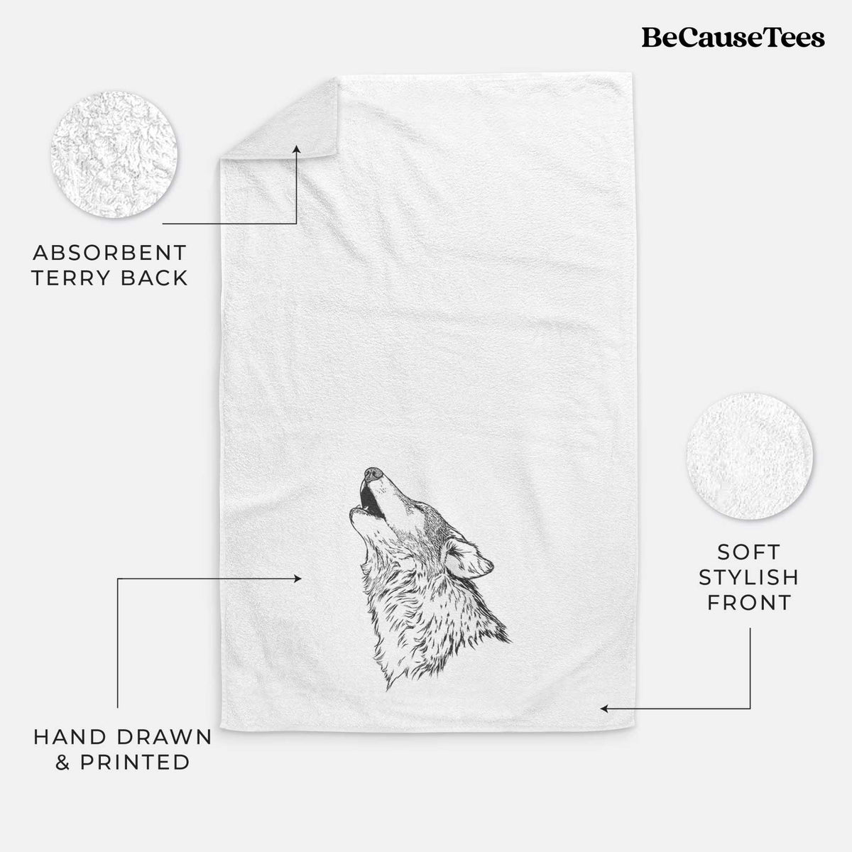 White hand towel printed with a detailed black ink illustration of a grey wolf's head and shoulders, howling upward.