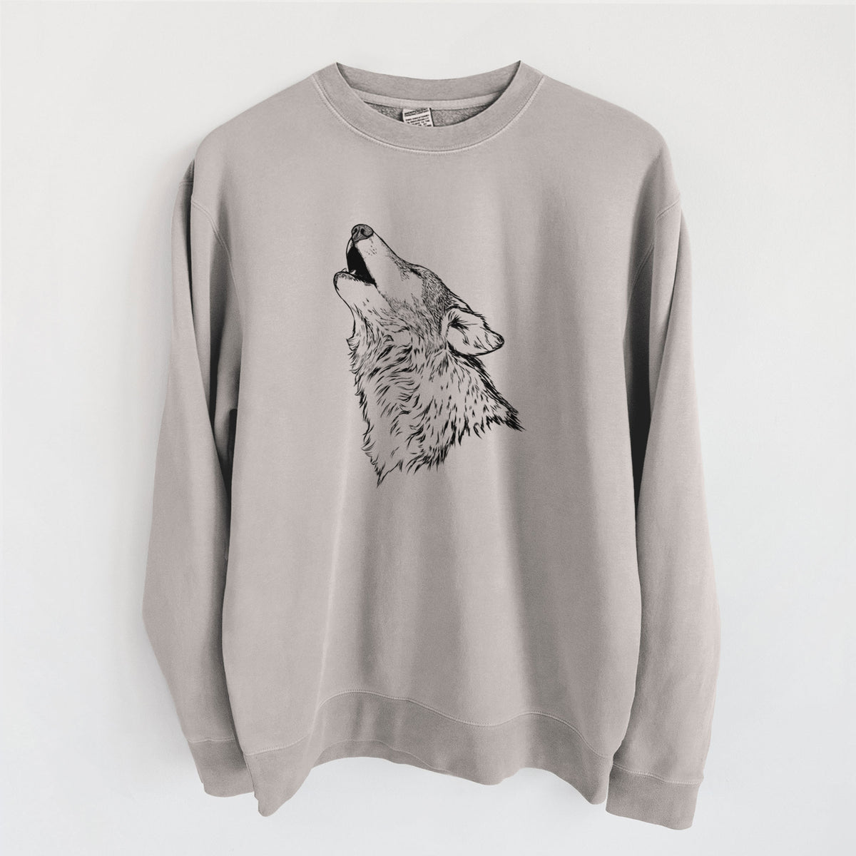 Cement grey pigment dyed crewneck sweatshirt laid flat, printed with a detailed black ink illustration of a grey wolf's head and shoulders, howling upward.