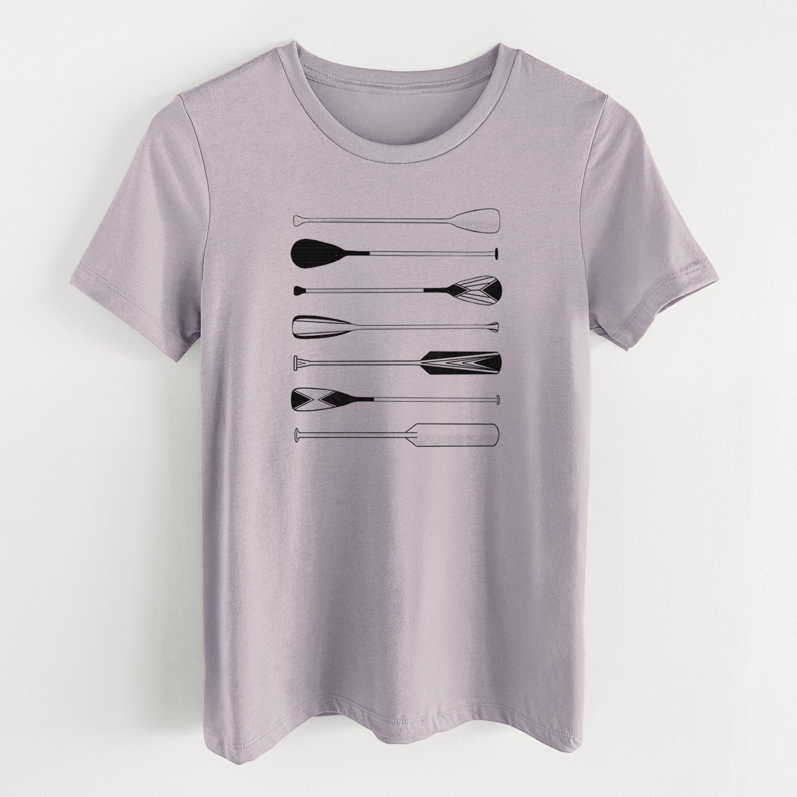 Light violet women's relaxed fit cotton t-shirt laid flat, printed with a black ink illustration of a row of canoe and kayak paddles.