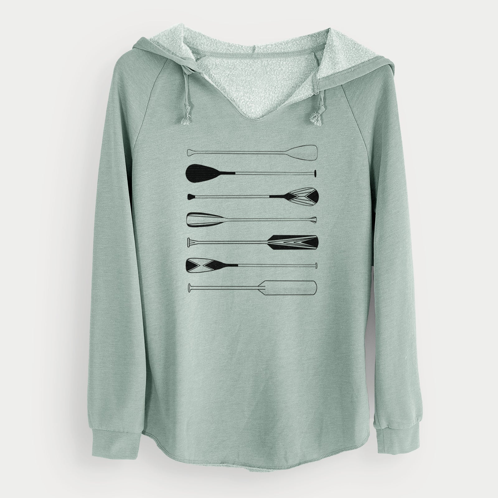 Sage green women's Cali Wave hooded sweatshirt laid flat, printed with a black ink illustration of a row of canoe and kayak paddles.