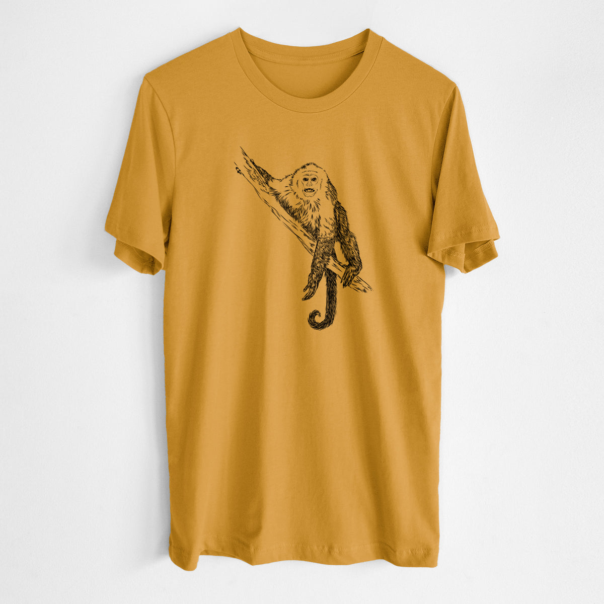 Honeycomb yellow lightweight cotton t-shirt laid flat, printed with a detailed black ink illustration of a capuchin monkey climbing a branch.