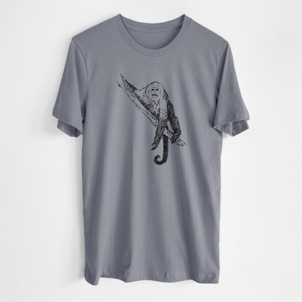Storm grey lightweight cotton t-shirt laid flat, printed with a detailed black ink illustration of a capuchin monkey climbing a branch.