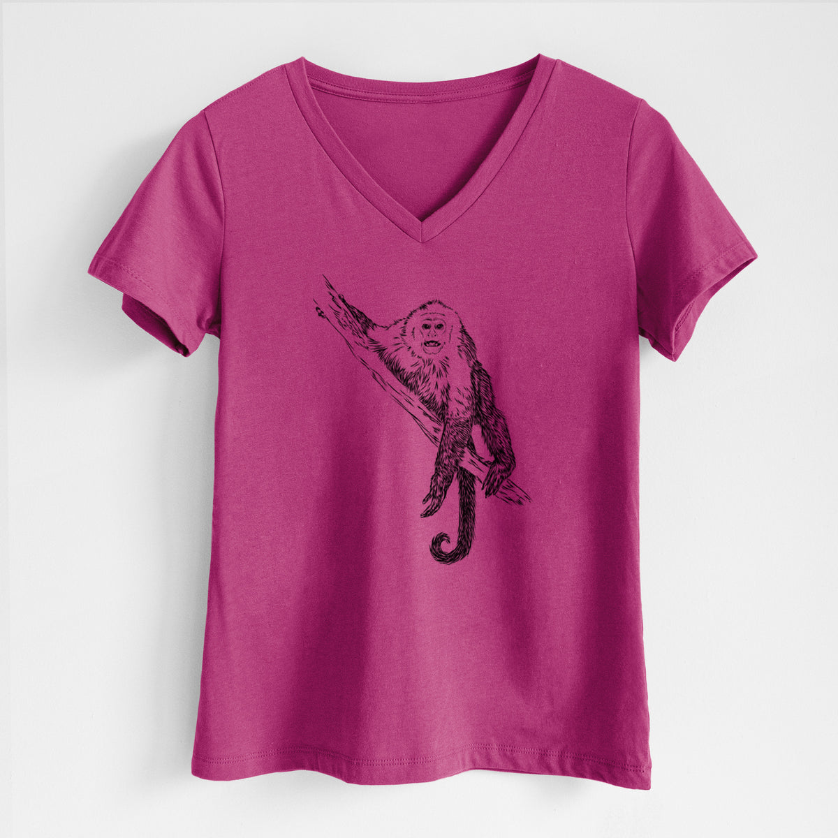 Berry pink women's relaxed fit cotton V-neck t-shirt laid flat, printed with a detailed black ink illustration of a capuchin monkey climbing a branch.