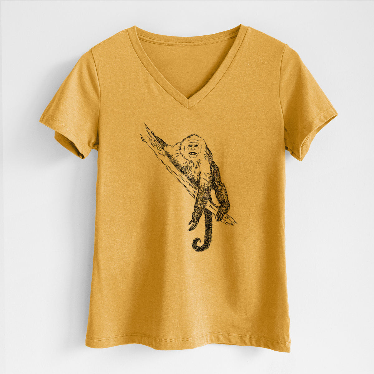 Honeycomb yellow women's relaxed fit cotton V-neck t-shirt laid flat, printed with a detailed black ink illustration of a capuchin monkey climbing a branch.