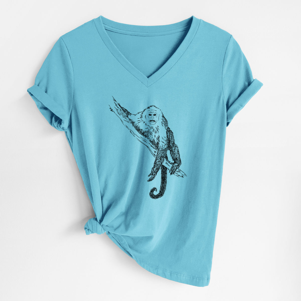 Turquoise women's relaxed fit cotton V-neck t-shirt laid flat, printed with a detailed black ink illustration of a capuchin monkey climbing a branch.