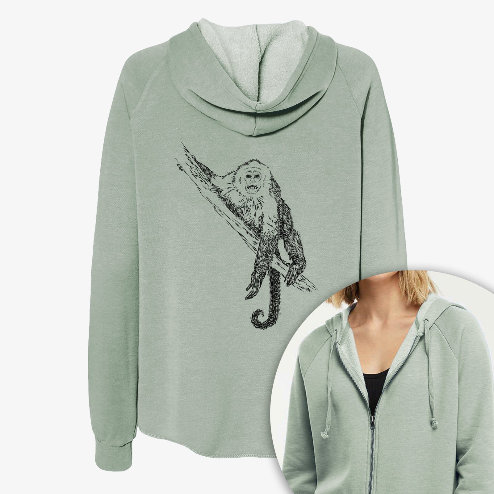 Women's Cali Wave zip-up sweatshirt printed with a detailed black ink illustration of a capuchin monkey climbing a branch, with a close-up of the zipper.