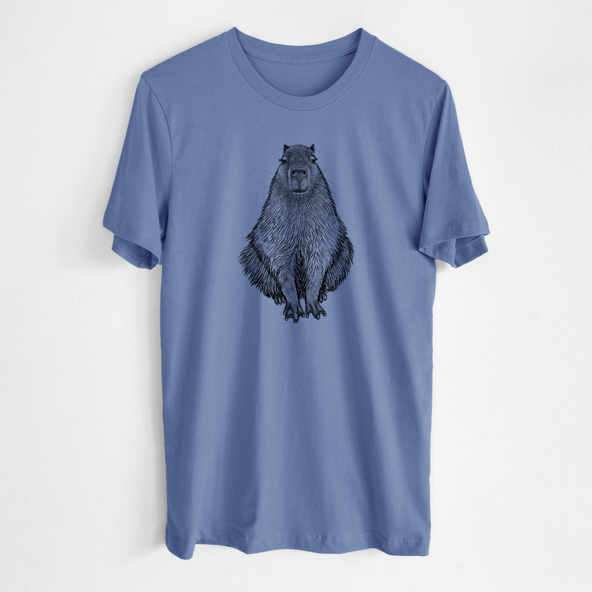 Blue bell lightweight cotton t-shirt laid flat, printed with a detailed black ink illustration of a capybara sitting and facing forward.