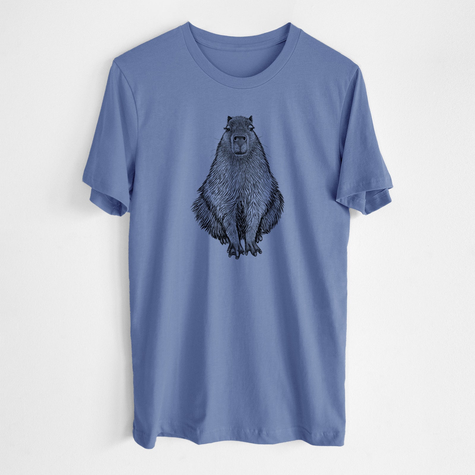 Blue bell lightweight cotton t-shirt laid flat, printed with a detailed black ink illustration of a capybara sitting and facing forward.