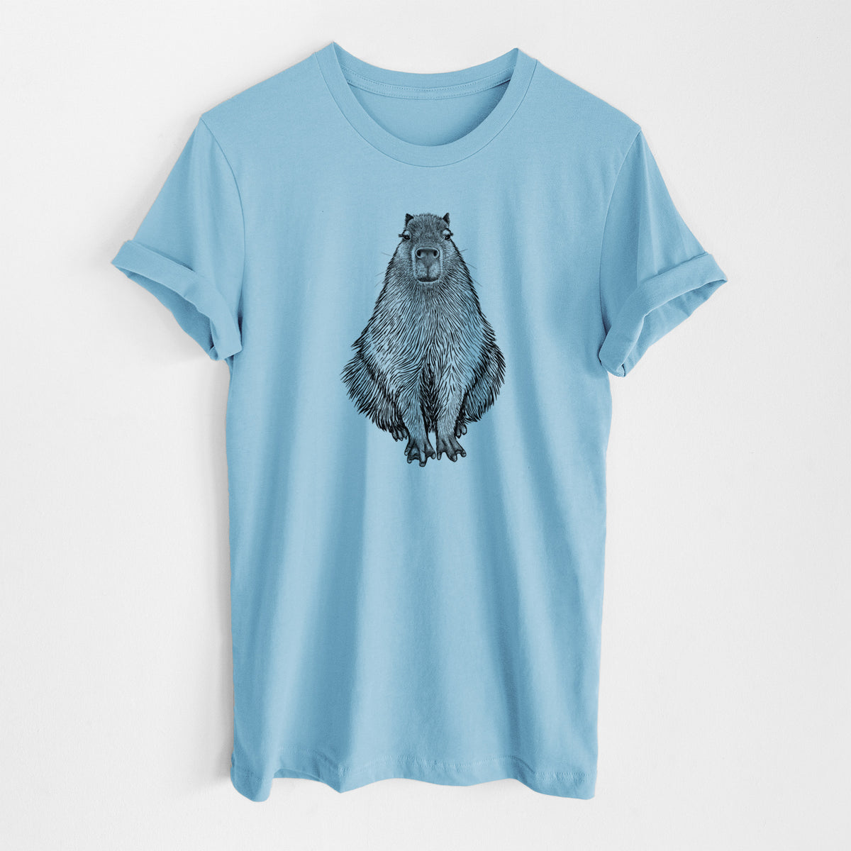 Ocean blue lightweight cotton t-shirt laid flat, printed with a detailed black ink illustration of a capybara sitting and facing forward.