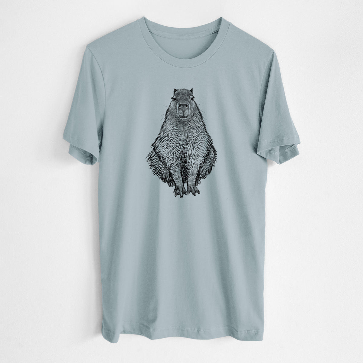 Vintage denim lightweight cotton t-shirt laid flat, printed with a detailed black ink illustration of a capybara sitting and facing forward.