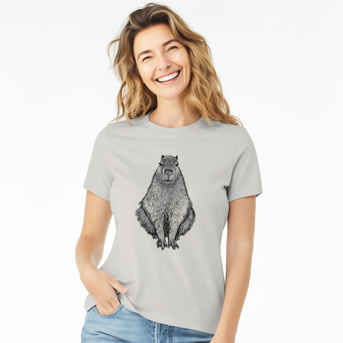Woman wearing a lunar grey women's relaxed fit cotton t-shirt printed with a detailed black ink illustration of a capybara sitting and facing forward.