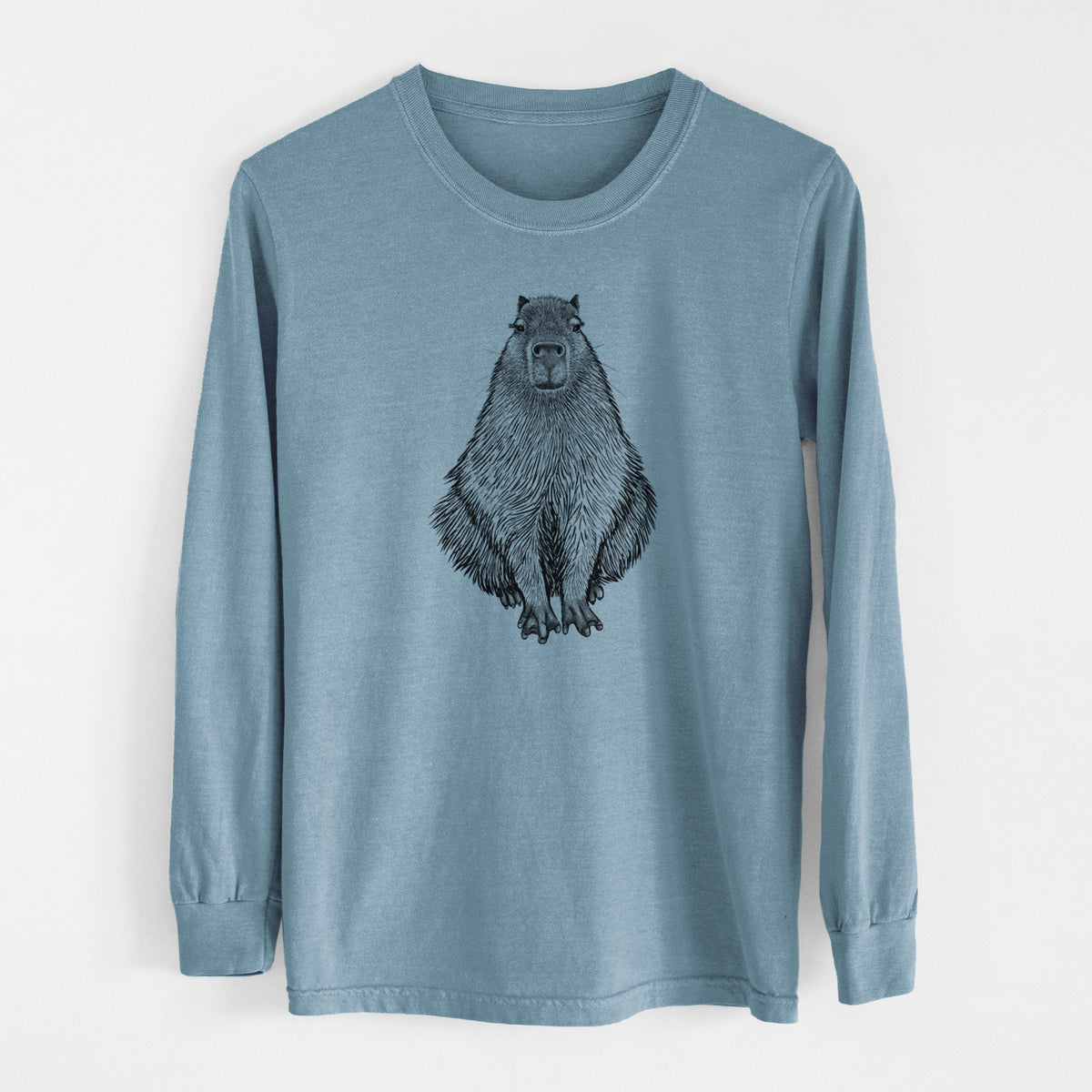 Steel blue Comfort Colors long sleeve shirt laid flat, printed with a detailed black ink illustration of a capybara sitting and facing forward.