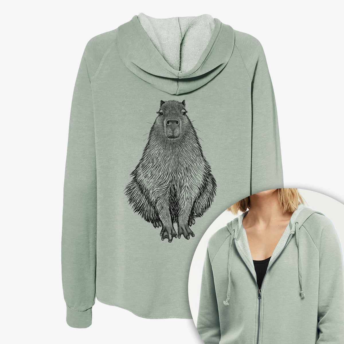 Women's Cali Wave zip-up sweatshirt printed with a detailed black ink illustration of a capybara sitting and facing forward, with a close-up of the zipper.