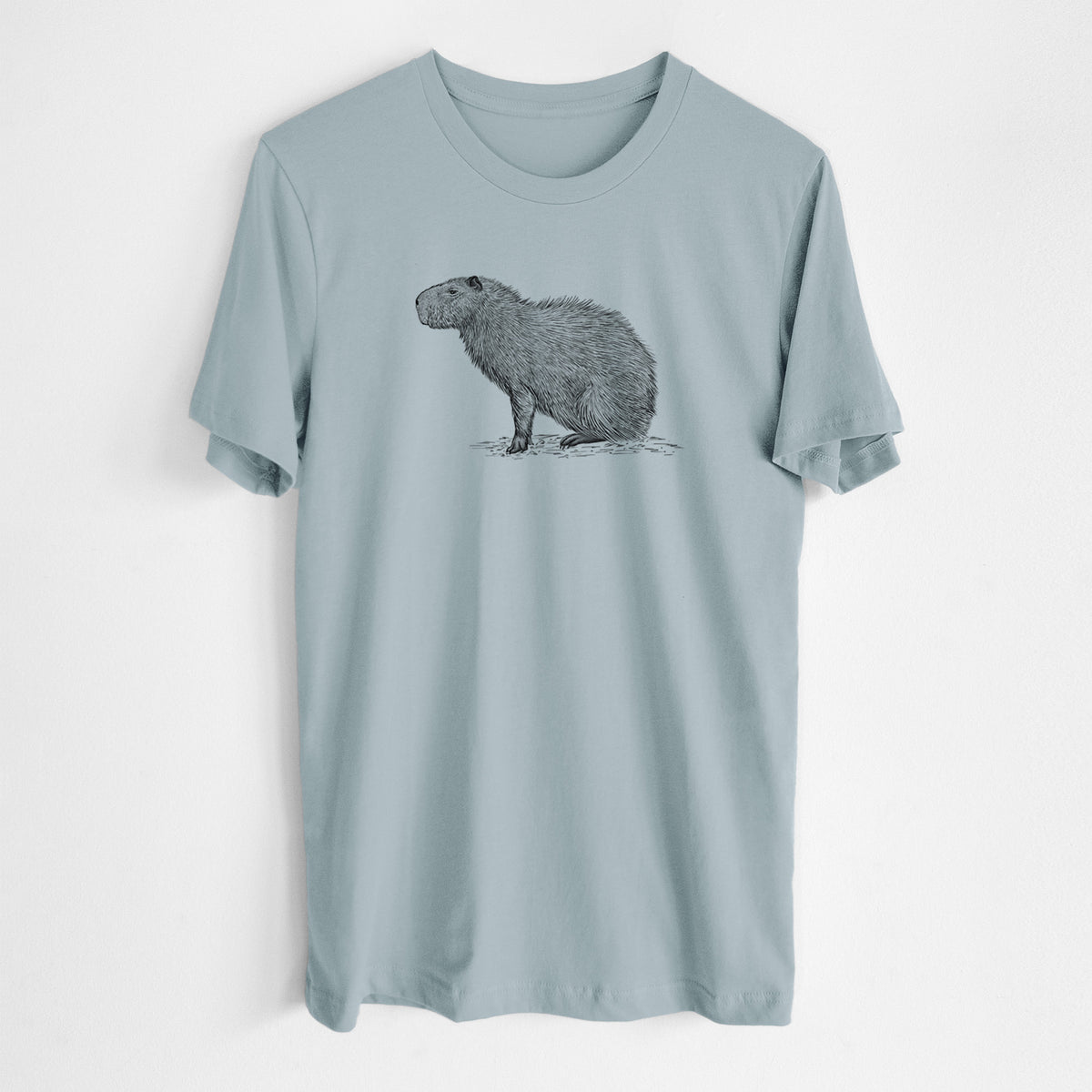 Vintage denim lightweight cotton t-shirt laid flat, printed with a detailed black ink illustration of a capybara standing in profile.