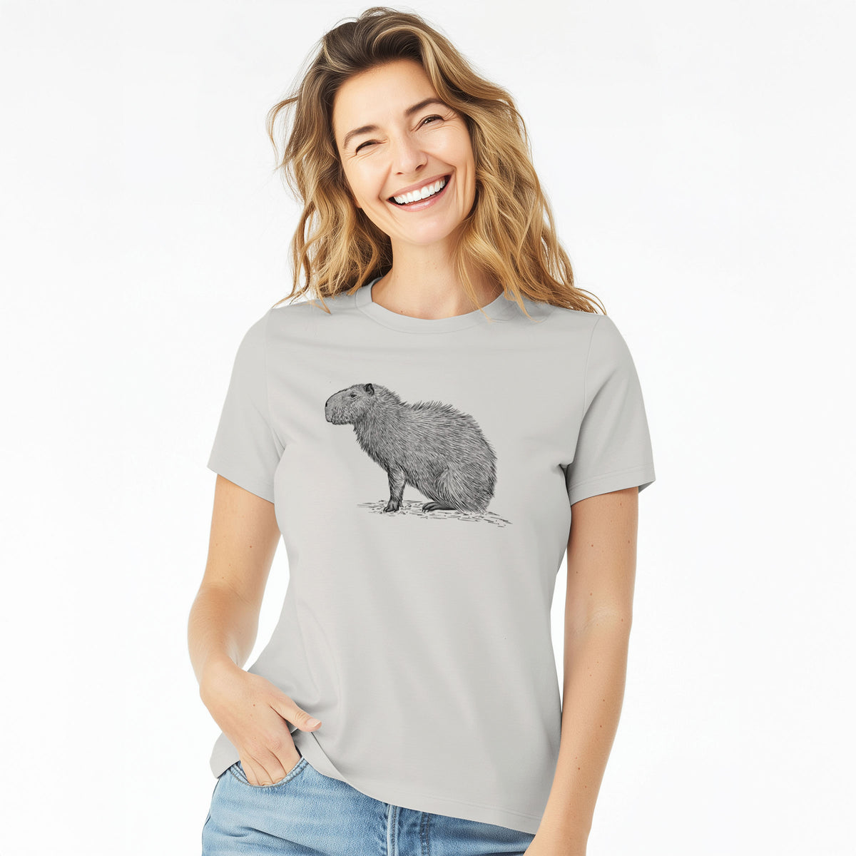 Woman wearing a lunar grey women's relaxed fit cotton t-shirt printed with a detailed black ink illustration of a capybara standing in profile.