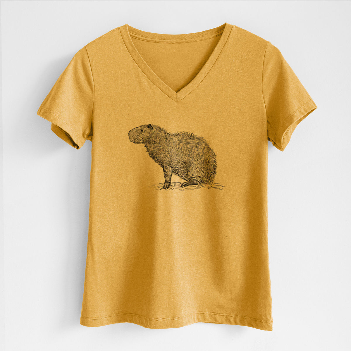 Honeycomb yellow women's relaxed fit cotton V-neck t-shirt laid flat, printed with a detailed black ink illustration of a capybara standing in profile.