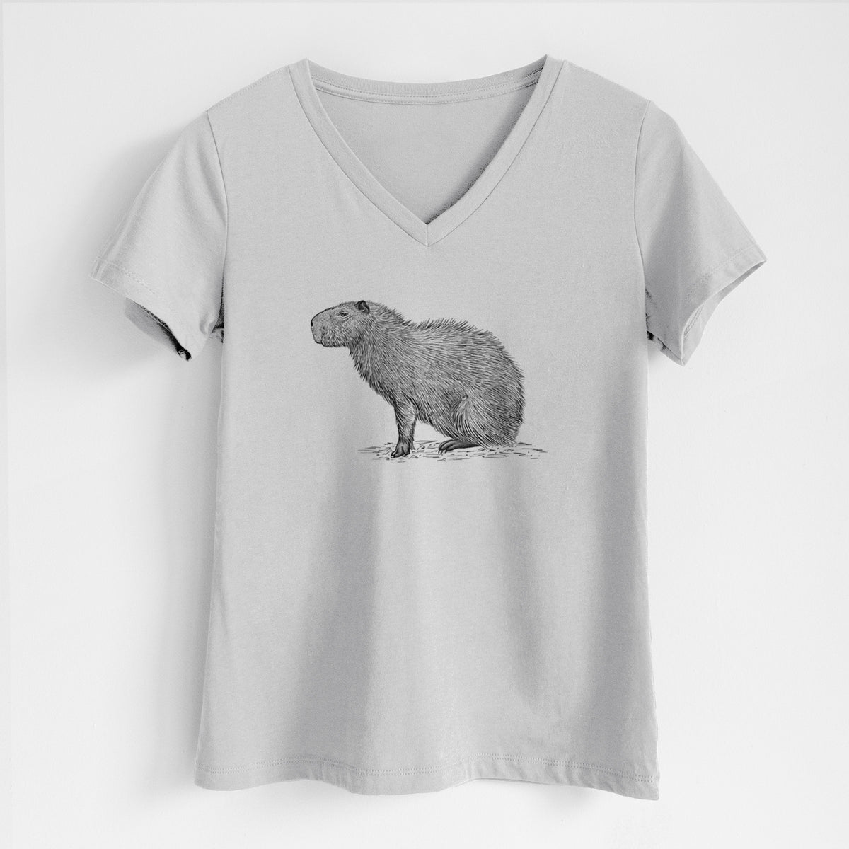 Lunar grey women's relaxed fit cotton V-neck t-shirt laid flat, printed with a detailed black ink illustration of a capybara standing in profile.