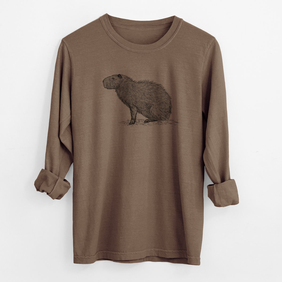 Espresso brown Comfort Colors long sleeve shirt laid flat with the cuffs rolled, printed with a detailed black ink illustration of a capybara standing in profile.