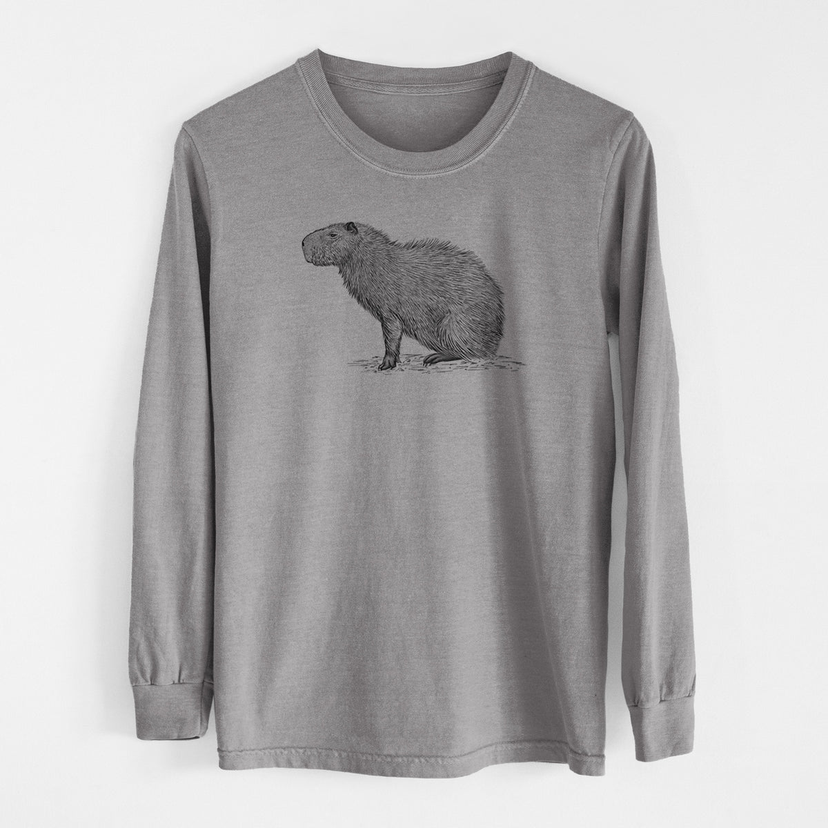 Grey Comfort Colors long sleeve shirt laid flat, printed with a detailed black ink illustration of a capybara standing in profile.