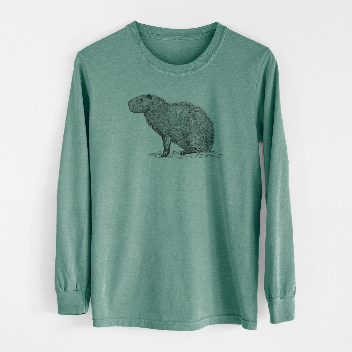 Pine green Comfort Colors long sleeve shirt laid flat, printed with a detailed black ink illustration of a capybara standing in profile.